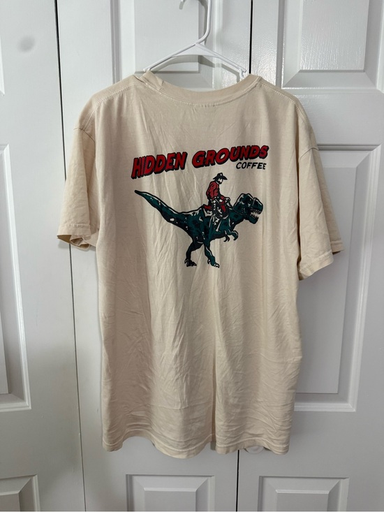 Comfort Colors Tops - “Hidden Grounds” Cowboy limited edition dinosaur t shirt